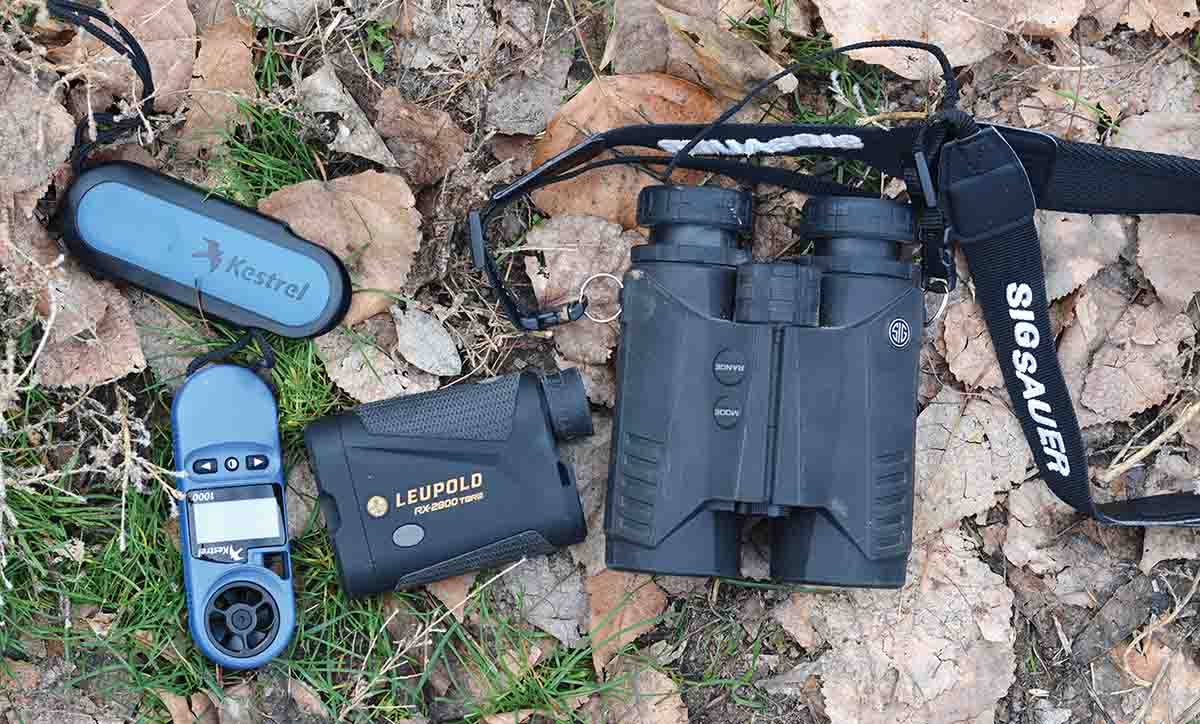 Important tools for the long-range shooter include a Kestrel wind meter, a Leupold laser rangefinder and a SIG Sauer binocular with a built-in laser rangefinder.